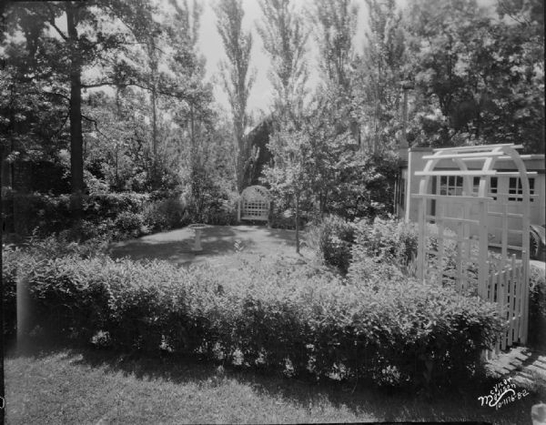 Garden behind a house, location unknown. Taken for McKay Nursery.