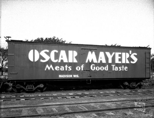 Oscar Mayer refrigerated railroad freight car with "Oscar Mayer's Meats of Good Taste" advertisement on the side.