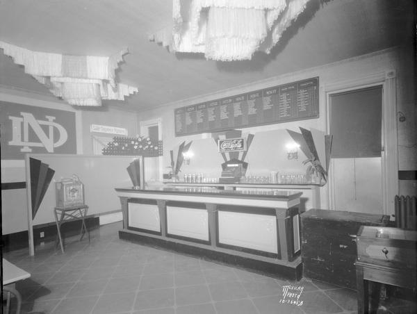 Martin's Restaurant Mark Martin's Restaurant, "The Trophy Room" with slot machine and sports score board on the wall, 2nd floor, 107 State Street.