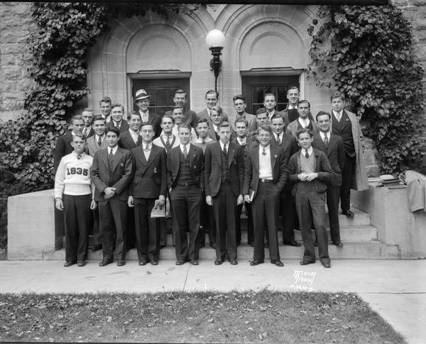 Group portrait of University of Wisconsin Botkin House male students in front of Tripp Hall.