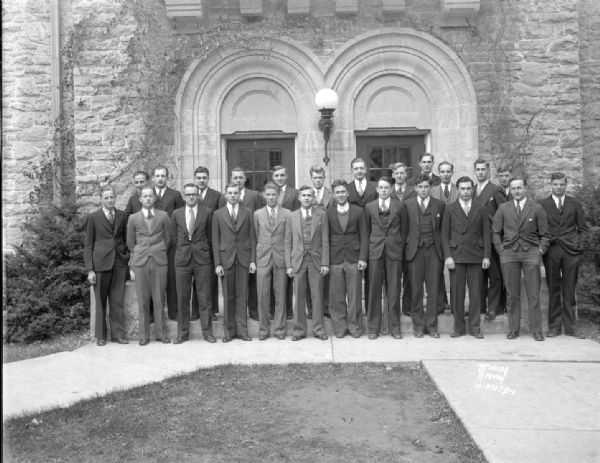 Group portrait of University of Wisconsin Tarrant House male students, taken in front of Adams Hall.