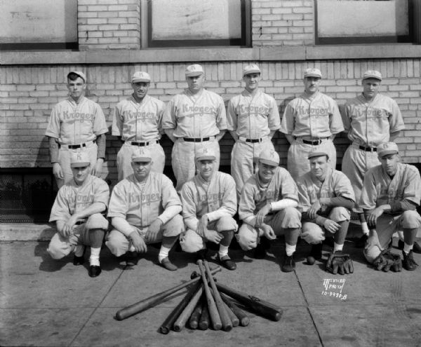 Group portrait of Kroger Grocery & Baking Co., baseball team in uniform.