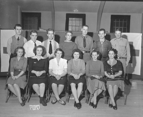 Group portrait of seven men and six women, members of Motorcycle club, at the American Red Cross Blood Bank, Dane County chapter.