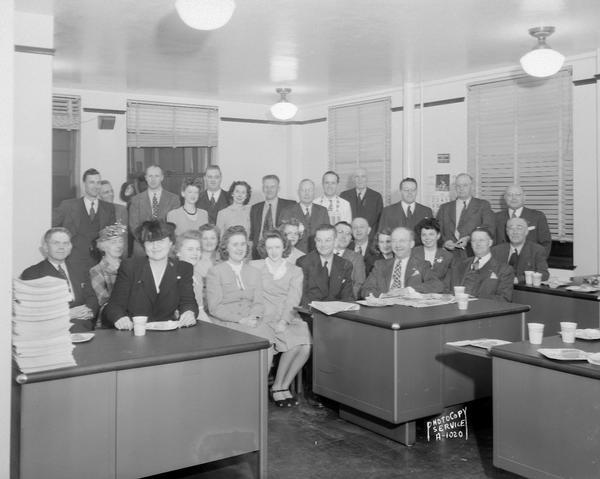 Group portrait of New York Life Insurance Company office staff and agents, 110 East Main Street.