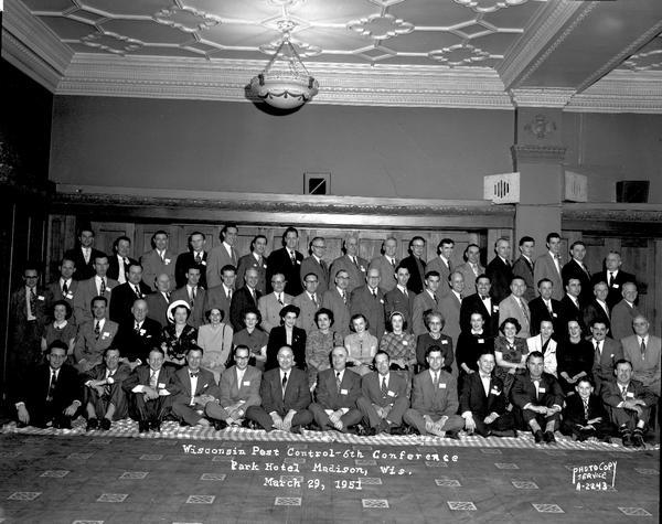 Group portrait of attendees at the Wisconsin Pest Control 6th Conference in the Waubesa Room, Park Hotel, 22 South Carroll Street.