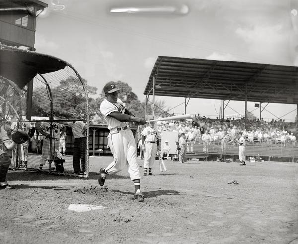 Henry "Hank" Aaron at bat during a Milwaukee Braves pre-season game.