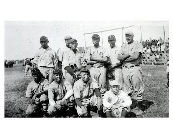 Indian school (U.S. Indian Service) baseball team, posed in uniform during a baseball game.