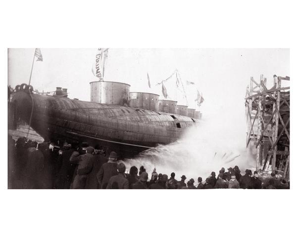 Launching Captain Abe McDougall's whaleback boat, "Christopher Columbus", from the American Steel Barge Company dock.