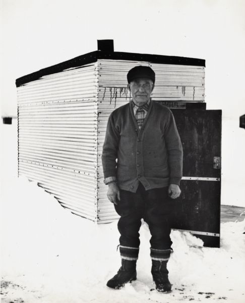 Ice fisherman Bruno Grotzke of Ashland poses in front of his fishing shanty on Chequamegon Bay.