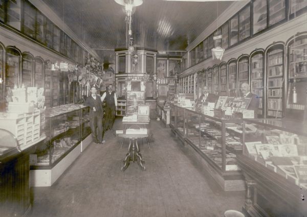 Interior view of the E.S. Purdy Drugstore, including four employees.