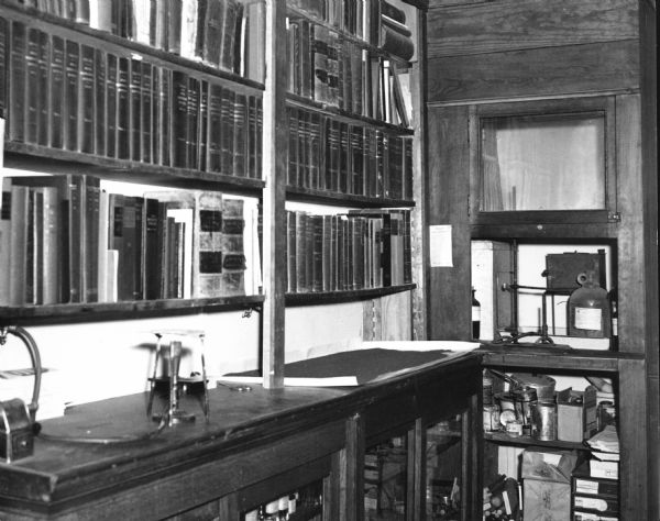 View showing part of the pharmacist's working library at D.F. Jones' Pharmacy.