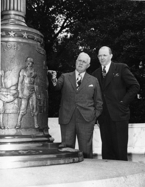 Robert Fischelis and H.A.B. Dunning examine the War Memorial at the American Pharmaceutical Association Headquarters building.