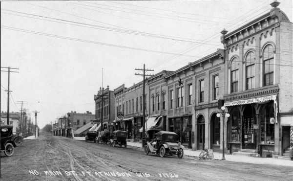 View of businesses located on north Main Street, including Winterburn Drugs and the First National Bank.