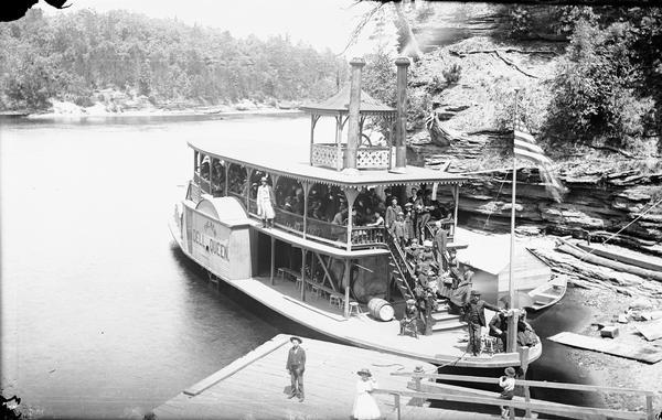 View looking down at the "New Dell Queen" steamboat and passengers.