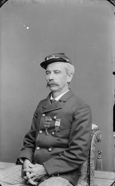 Studio portrait of H.H. Bennett wearing a GAR (Grand Army of the Republic) uniform.