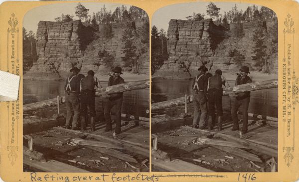 Stereograph of four raftsmen shipping an oar in the Dells.