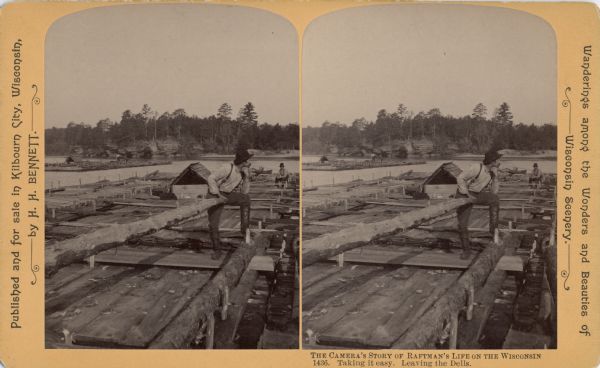 Stereograph of a raftsman, Jim Aljoe, standing with his elbow propped on his knee holding the end of the rudder. A second man is sitting on the raft in the background. There is a second raft in the distance.