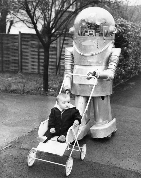 An infant being pushed in a baby flyer (baby carriage) by a robot in Leeds, England.