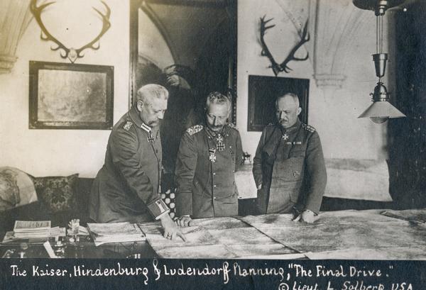 Kaiser Wilhelm II with Paul von Hindenburg and Erich Ludendorff, commanders on the World War I western front, planning military strategy.
