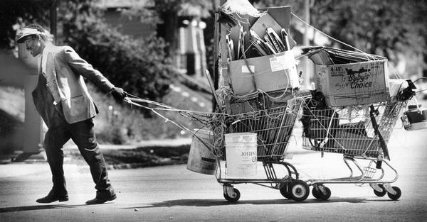 A caravan of carts full of recyclables is towed by the man who collected them to earn a little extra cash.