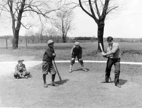 Boys playing baseball on the grounds of Viall School.