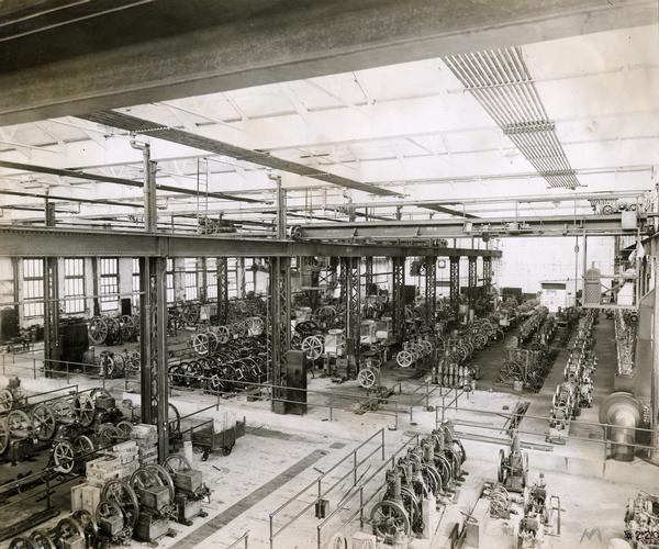 Stationary engines inside a warehouse at International Harvester's Milwaukee Works. The factory was owned by the Milwaukee Harvester Company before 1902.