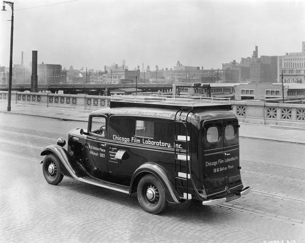 International C-1 "industrial motion picture sound truck" in transit along a Chicago city street. The truck was owned by the Chicago Film Laboratory.
