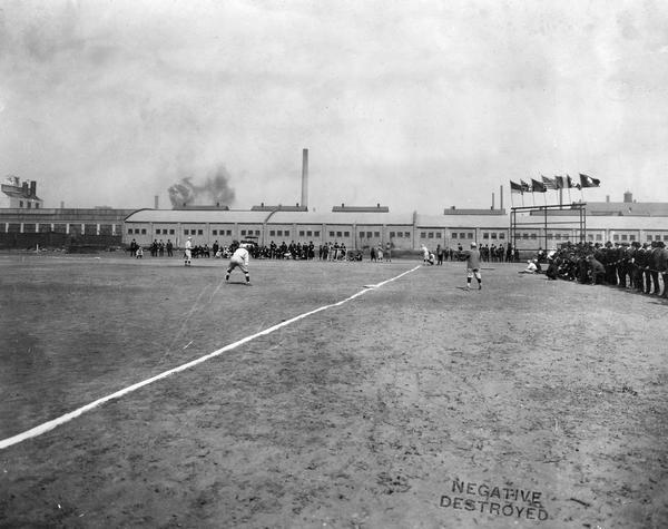 Baseball game at Tractor Works, an International Harvester factory.