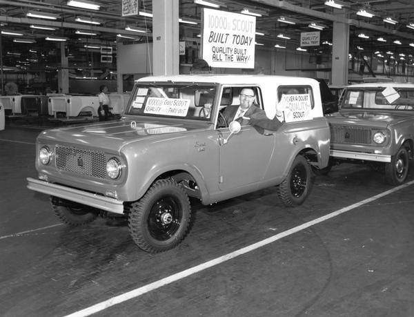 The 10,000th International Scout built by IHC's motor truck division is driven off the final assembly line at the Fort Wayne plant by D.F. Kuntz, Divisional Sales Manager. After 90 days of public availability, production of the all-purpose Scout increased to 164 units daily from the 50 per day rate originally scheduled. The 10,000th Scout pictured here is a four-wheel drive model with Travel-Top.