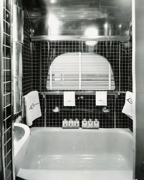 Bathroom of an International "Jungle Yacht," complete with his and her toiletries and towels embroidered with the letter "G" for Gatti. International Harvester produced custom-built trucks called "Jungle Yachts" for Commander Attilio Gatti's tenth expedition to the African Congo.