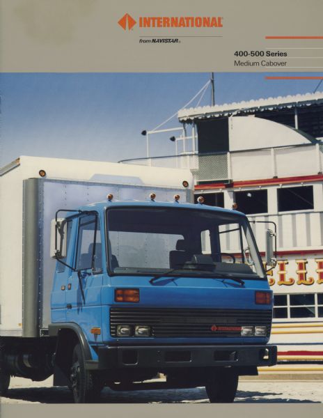 Front cover of a brochure advertising International 400-500 Series Medium Cabover trucks. Features a color photograph of an International 400 delivery truck. A steamboat or a ship is in the background.