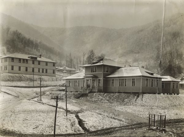YMCA building, with Benham Hotel and mountains in thevbackground. Benham was an International Harvester "company town."