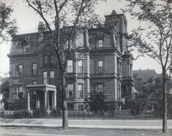 The facade of the McCormick family residence at 675 Rush Street, which takes up an entire block between Erie and Huron Streets. Cyrus Hall McCormick, Sr. hired Cudell and Blumenthal, a leading architectual firm of the time, to design the French Renaissance style home. Construction started after the Chicago fire in 1874, and was completed in 1879. Three generations of the family lived there, but it was eventually sold by the Cyrus Hall McCormick estate in 1945 and razed in the 1950's.