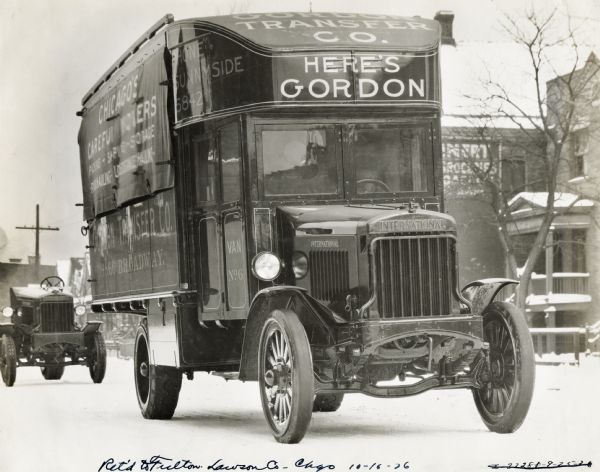 International Model 63 truck operated by the Chicago-based Gordon Transfer Company. The truck is on a snow-covered street in what appears to be an urban, residential neighborhood. The side of the bed reads: "Chicago's Careful Movers."
