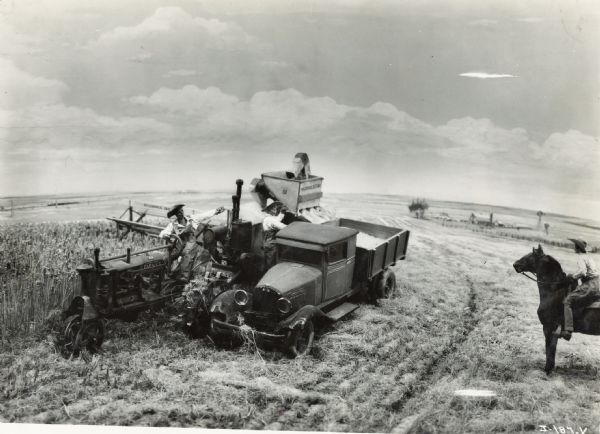A model or diorama depicting farmers with a Farmall tractor, truck, harvester-thresher (combine) and a horse in a field. The display was likely part of International Harvester's exhibit at the "A Century of Progress" world's fair in Chicago.