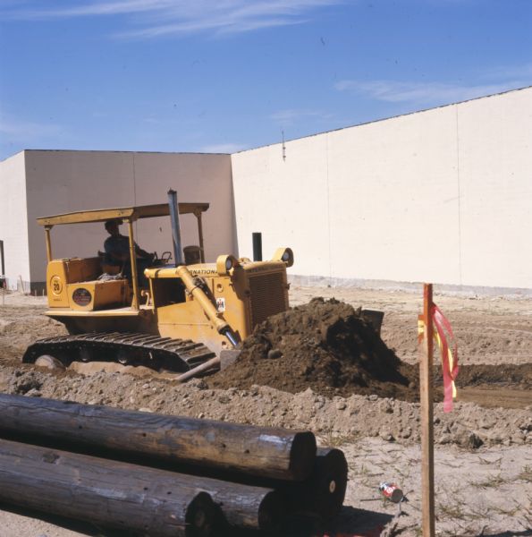 TD-20C Crawler Tractor Construction Scene Color photograph of an International TD-20C crawler tractor (TracTracTor) operated by a man employed in site development for the A.J. Gallo Corp., Framingham, Mass.