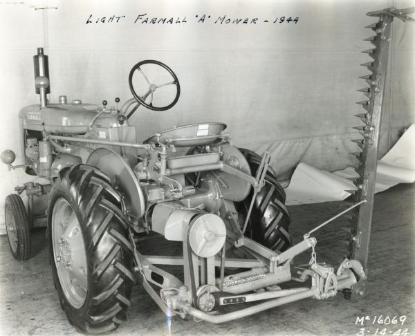 Farmall A Tractor with Mower Engineering three-quarter left side view from rear of a Farmall A tractor with a mower attachment.