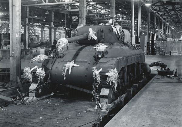Military tank prepared for shipment at International Harvester's Bettendorf tank arsenal (factory).