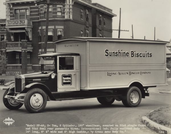 International truck used by Sunshine Biscuits, Loose-Wiles Biscuit Company. Original caption reads: "Model SF-46 2 ton, 6 cylinder, 180" wheelbase, mounted on 32x6 single front and 32x6 dual rear pneumatic tires. International cab. Fully enclosed body 14' long, 6'4" wide and 6' high inside, by Krane Auto Body Co."