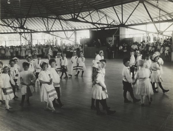 Students of Palos Park School folk dancing at an annual school festival in Belwood Park.
