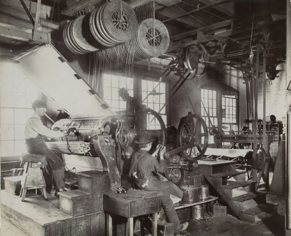 Factory workers at a canvas machine at the McCormick Reaper Works.