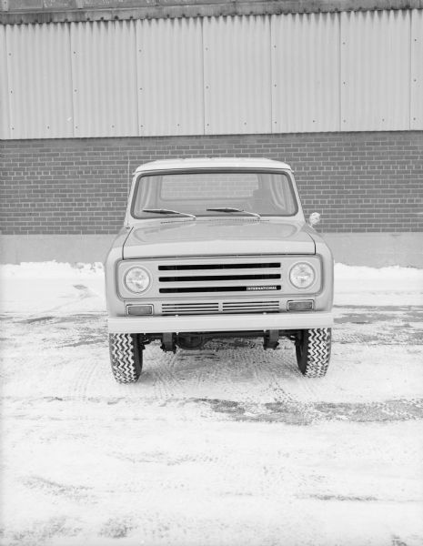 Front View of Scout Front view of Scout parked outdoors in the snow. Industrial brick building in the background.