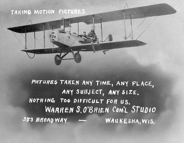 The business card of Waukesha photographer Warren O'Brien, a pioneer in aerial photography in Wisconsin. The illustration shows him sitting on the wing of a Curtiss Jenny. Walking on the wing to this position was a trick he learned from pilot Cash Chamberlain. At other times O'Brien's relatives would sit on his legs as he knelt on the seat in the cockpit. In this case, however, the picture was taken on the ground. An avid aviator himself, O'Brien served as both president and historian of the Waukesha Aviation Club.