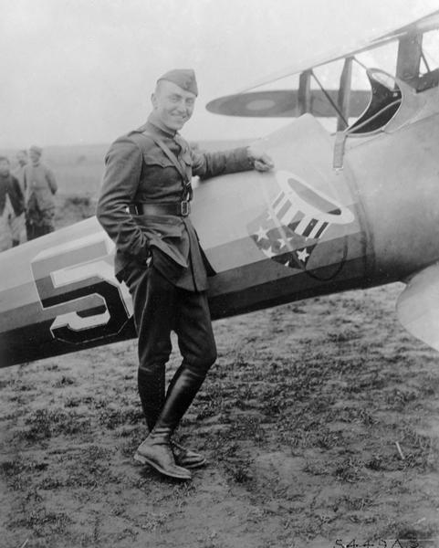Captain Edward V. Rickenbacker, who earned the title "Ace of Aces" for his 27 victories during World War I. In this photograph he is posed against a plane from his 94th "Hat-in-the-Ring" Squadron.