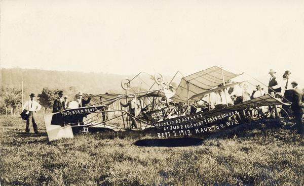Wisconsin's first air fatality was P.C. Davis, an exhibition pilot from Chicago, who died as a result of injuries sustained during an aerial performance in Mauston. Caption reads: "Wreck of Aeroplane at Juneau County Fairgrounds, Sept. 5, 1913. Mauston, Wis."