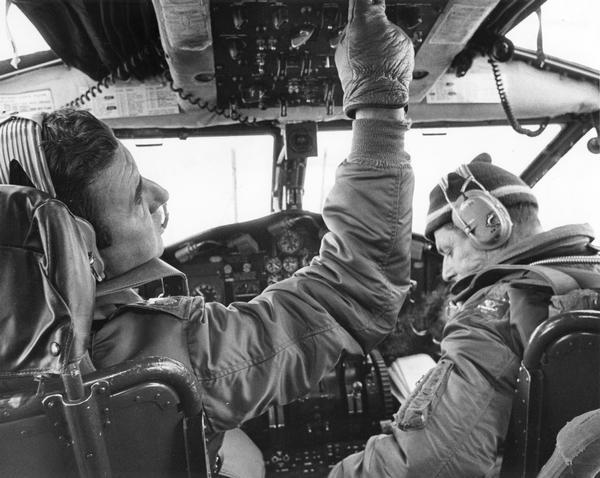 View of the cockpit as Lt. Col. Joseph Bourassa and co-pilot Leonard Dereszynski of the 440th Tactical Airlift Wing of the Air Force Reserve at General Mitchell Field prepare to shut down a C-119 for the last time. Along with the other C-119s assigned to the 440th, this plane had been flown to Davis Monthan Air Force Base in Arizona where it was to be scrapped. The pilot told the reporter covering this story that he had flown the same two-engine, unpressurized model during the Korean War.