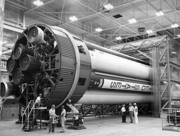 Workmen making adjustments for launch are dwarfed by the Saturn SA-5 booster rocket, a preliminary stage in the development of the Saturn V. Eventually, Saturn V would be used to launch the Apollo missions of the late 1960s and early 1970s and the Skylab Space Station.  This photograph is part of the NASA press materials collected by NBC reporter Robert Goralski. His papers are available for research at the Wisconsin Historical Society Archives.
