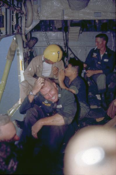 This photograph labeled only as "Manhunt" by Milwaukee photographer Dickey Chapelle shows the interior of a helicopter used during the early stages of U.S. involvement in the Vietnamese War.