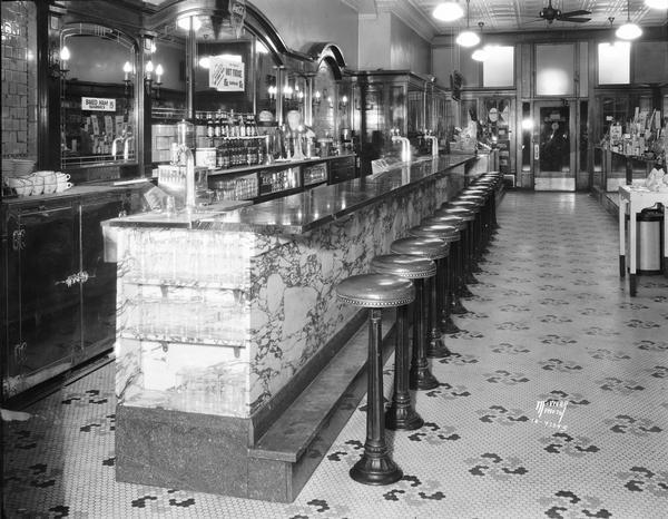 The soda fountain at Rennebohm Drug Store #3 in the Levitan Building at 13 West Main Street provides an excellent view of the store's interior decoration.
