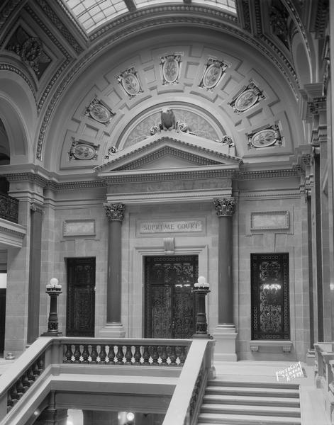Supreme Court doorway, with a sculpture of a badger over the door in the Wisconsin State Capitol.